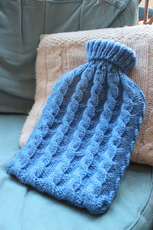 Knitted hot water bottle cosy