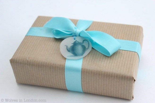 Wrapped present with teapot gift tag