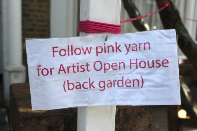Follow pink yarn sign